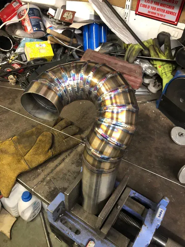 Custom stainless exhaust bend with TIG welds