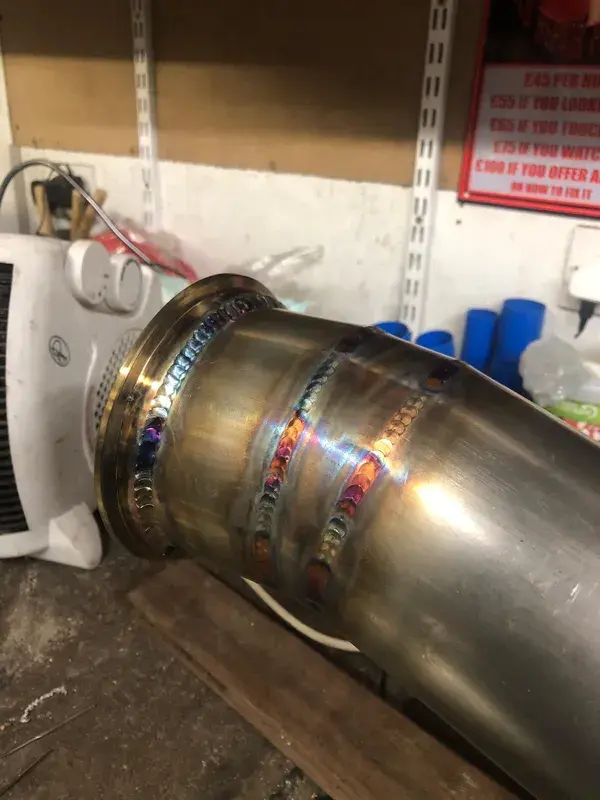TIG-welded stainless steel exhaust downpipe close-up