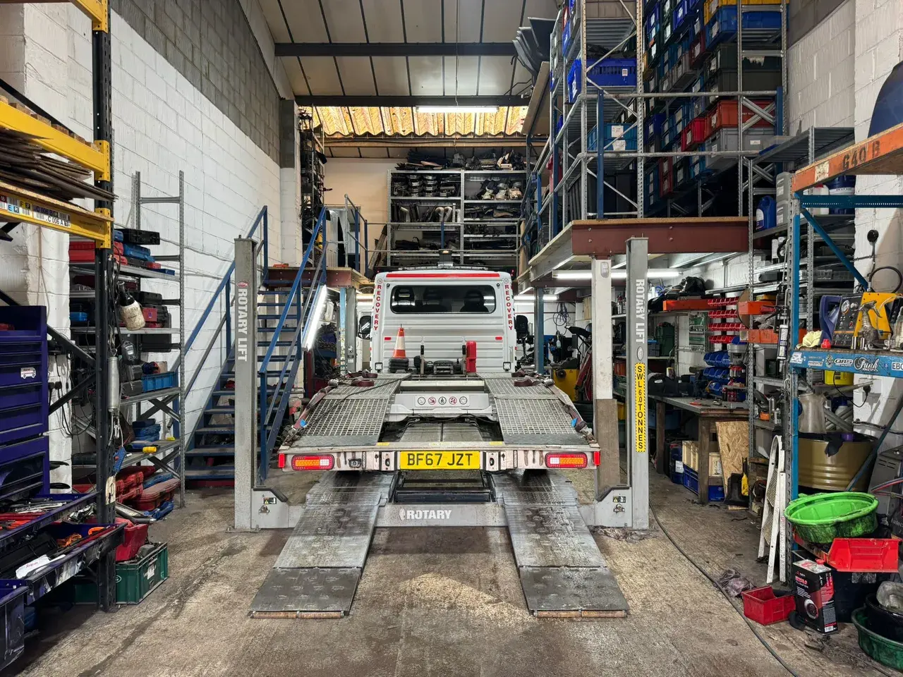 Recovery truck on the ramp inside the workshop