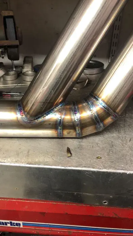 Hand-welded exhaust tubing